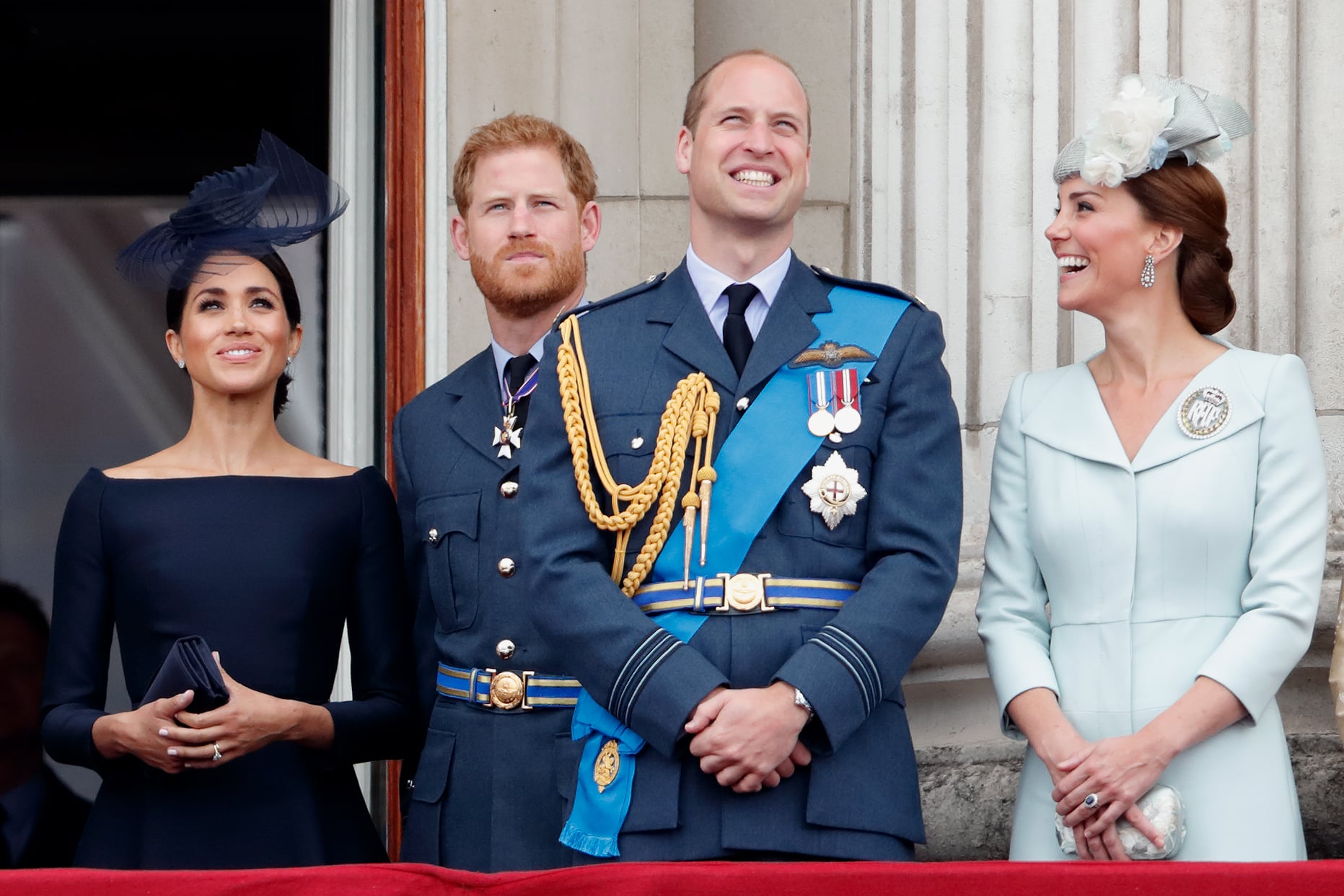 LONDON, UNITED KINGDOM - JULY 10: (EMBARGOED FOR PUBLICATION IN UK NEWSPAPERS UNTIL 24 HOURS AFTER CREATE DATE AND TIME) Meghan, Duchess of Sussex, Prince Harry, Duke of Sussex, Prince William, Duke of Cambridge and Catherine, Duchess of Cambridge watch a flypast to mark the centenary of the Royal Air Force from the balcony of Buckingham Palace on July 10, 2018 in London, England. The 100th birthday of the RAF, which was founded on on 1 April 1918, was marked with a centenary parade with the presentation of a new Queen's Colour and flypast of 100 aircraft over Buckingham Palace. (Photo by Max Mumby/Indigo/Getty Images)