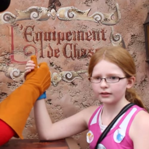 Girl Challenges Gaston to Arm Wrestling Contest at Disney