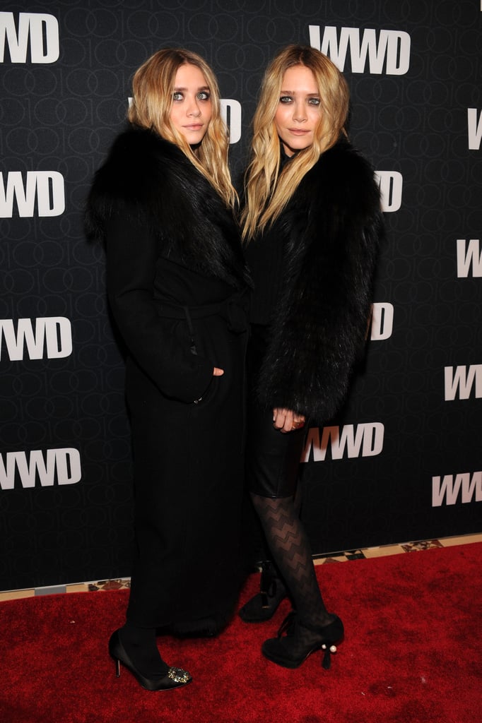 Twinning combo: The sisters jazzed up their signature all-black looks with luxe fur toppers at WWD's 100 Anniversary celebration in November 2010.

Ashley was cozy-chic in a long, fur-trimmed coat and jeweled satin pumps.
Mary-Kate chose a shorter plush topper, leather skirt, and zigzag-print tights.