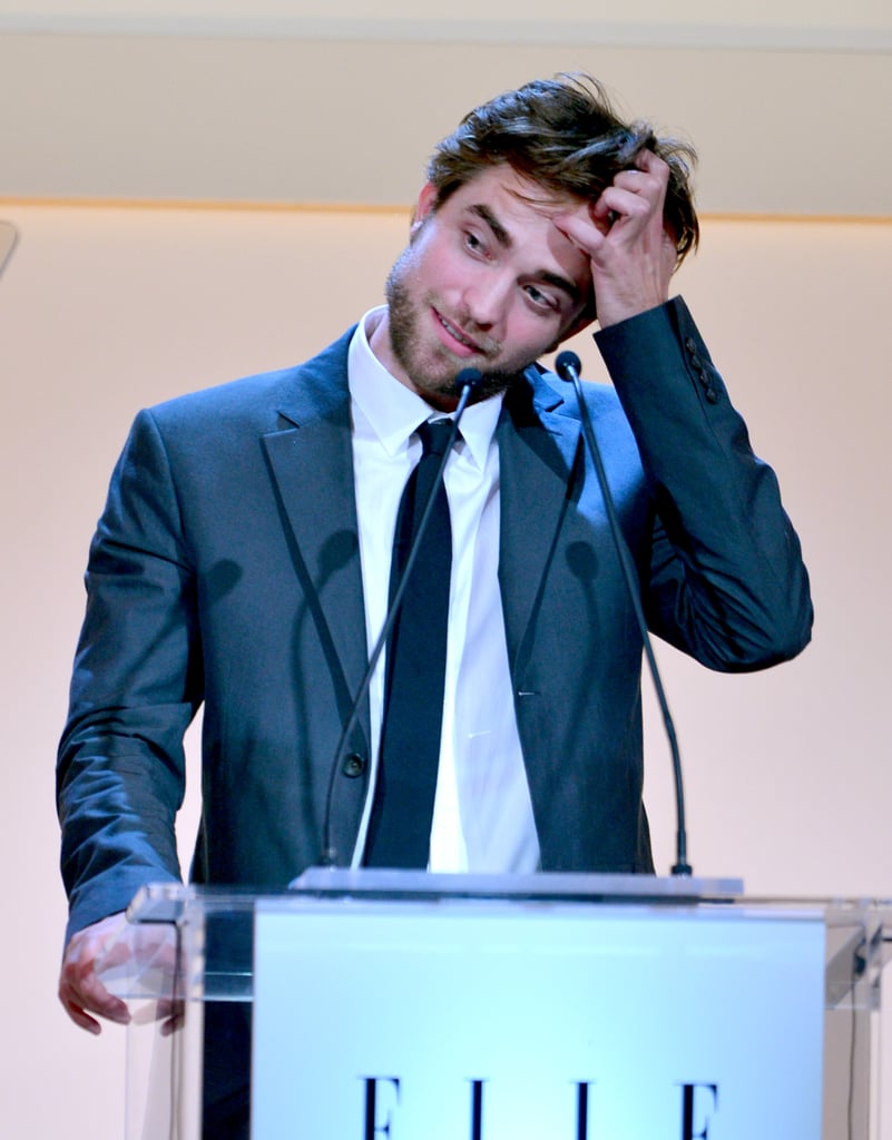 Robert couldn't help reaching for his man while delivering a speech at Elle's Women in Hollywood event in LA in October 2012.
