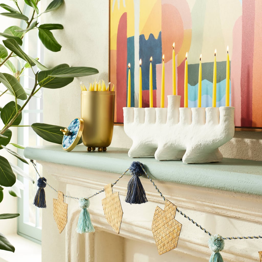 A Menorah: Opalhouse designed with Jungalow Carved Clay Menorah Candle Holder