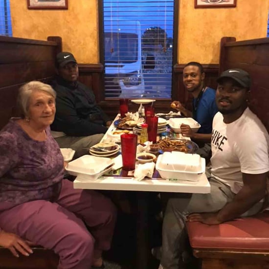 Man Approaches Elderly Woman Eating Alone