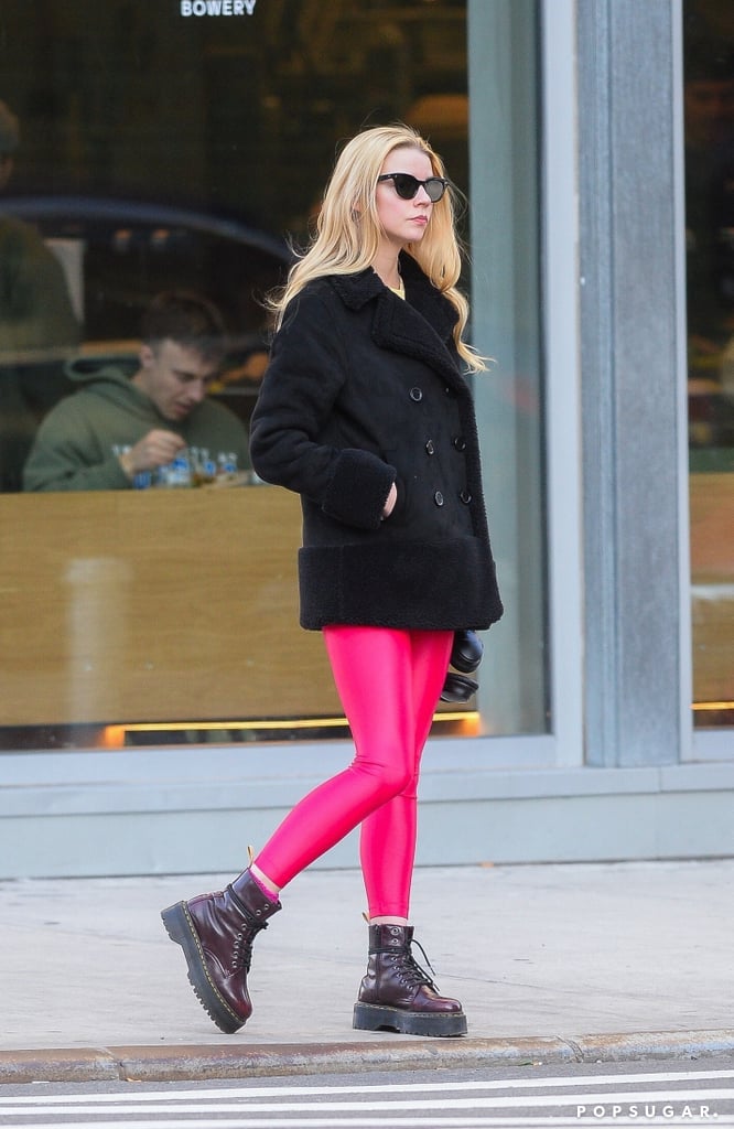 You may not think to style neon leggings with Dr. Martens, but Anya made the combination work with a shearling coat and cat-eye sunglasses in NYC.