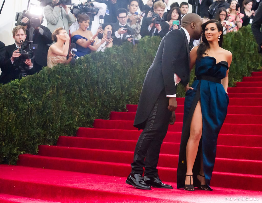 Kanye West whispered in Kim Kardashian's ear during their red carpet run.