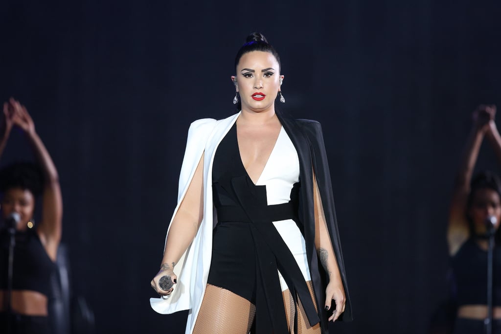 Proving the impact of stark black and white, Lovato rocked the stage in a caped bodysuit at the Rock in Rio Lisboa music festival in Lisbon, Portugal, in 2018.