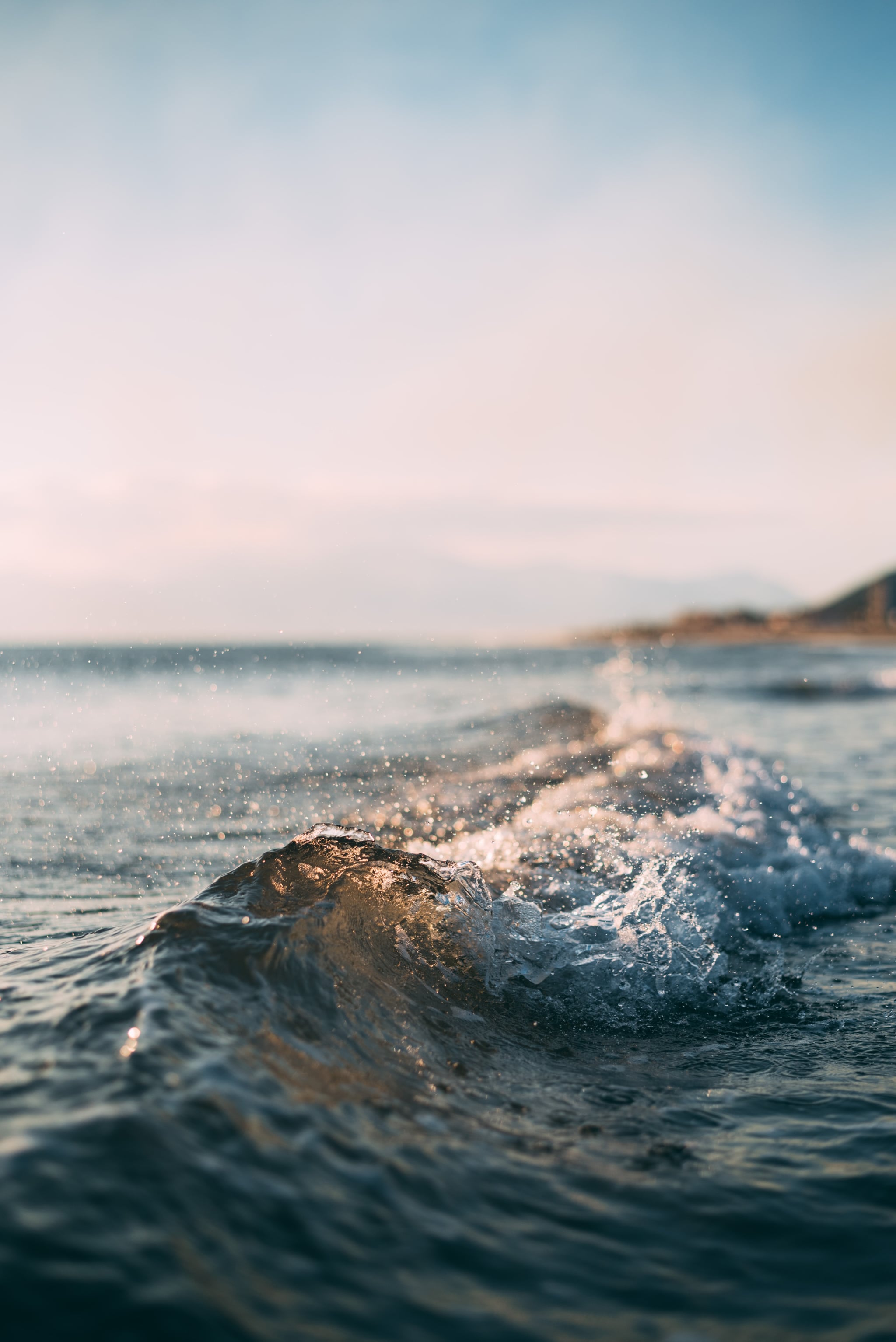 Serene blue ocean waves lap against golden sandy shores. Vertical Mobile  Wallpaper AI Generated 29296518 Stock Photo at Vecteezy