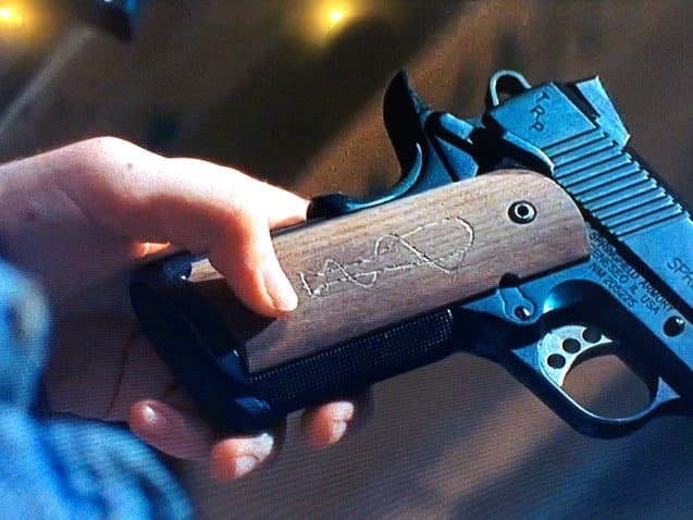 The Pistol With Negan's Symbol Carved Into it