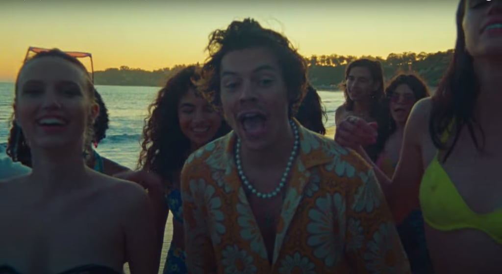 Styling his yellow flowery Bode shirt with matching side-striped shorts and one of his signature pearl necklaces.