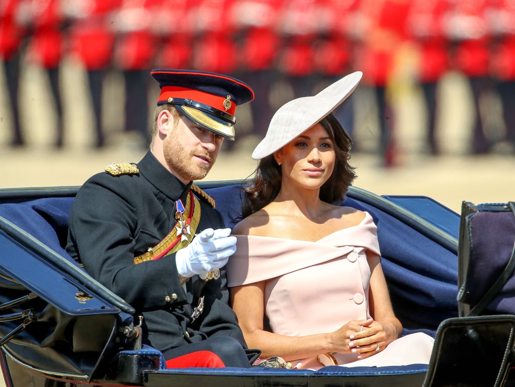 Meghan stunned in this sugar-pink Carolina Herrera off-the-shoulder dress at Trooping the Colour in 2018, topped off with a Philip Treacy hat.