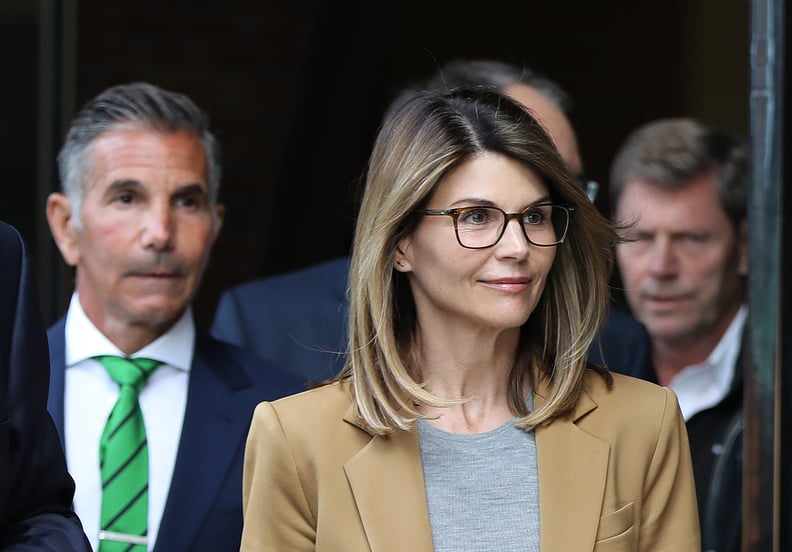 BOSTON, MA - APRIL 3: Actress Lori Loughlin and her husband Mossimo Giannulli, wearing green tie at left, leave the John Joseph Moakley United States Courthouse in Boston on April 3, 2019. Hollywood stars Felicity Huffman and Lori Loughlin were among 13 p