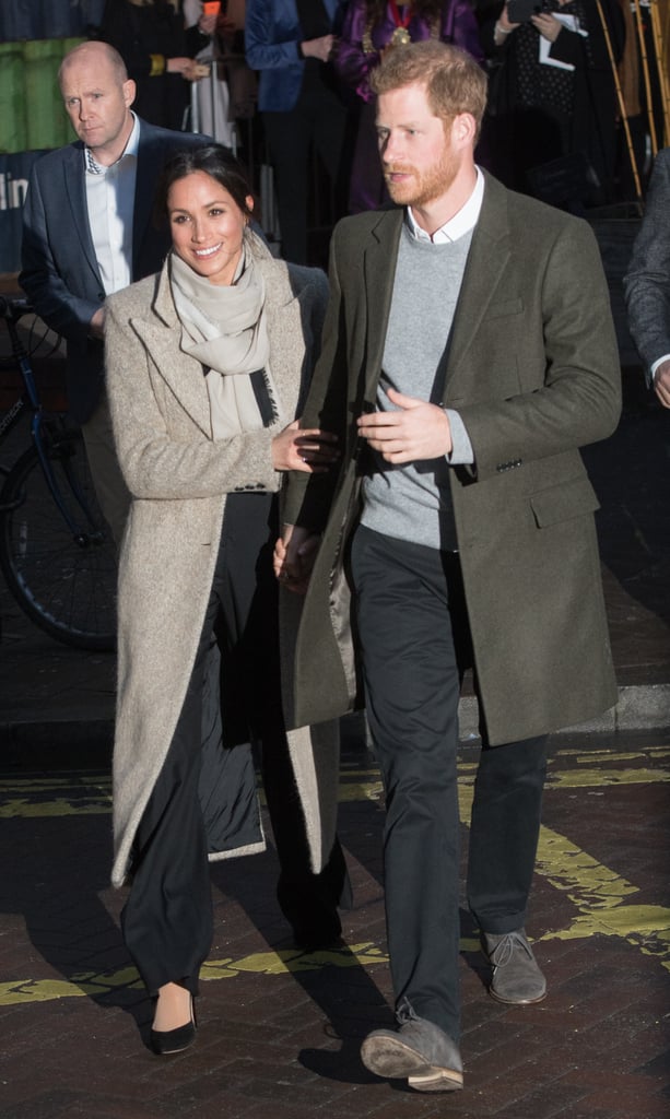 When they visited the Reprezent radio station in London, Harry and Meghan both opted for a very neutral colour palette. Harry wore a khaki coat, while Meghan chose a grey Smythe piece.