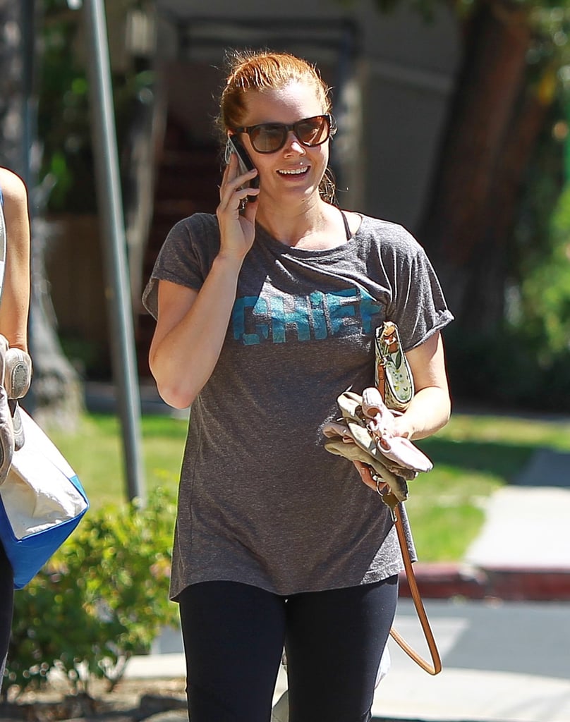 Amy Adams flashed a smile while chatting on the phone in LA on Tuesday.