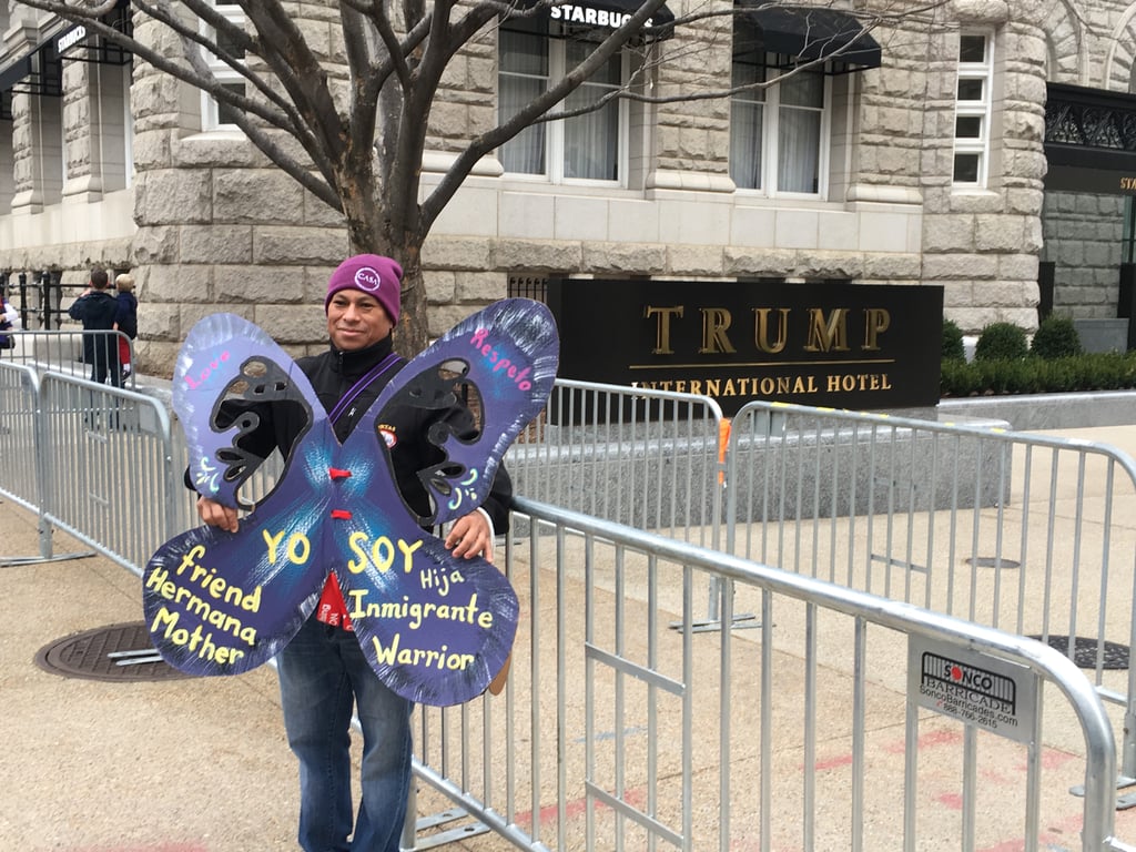 Jose is an immigrant from Mexico. He stood in front of Trump's hotel with this "I am" sign and told us, "El no me quiere," which means, "He doesn't want me here."