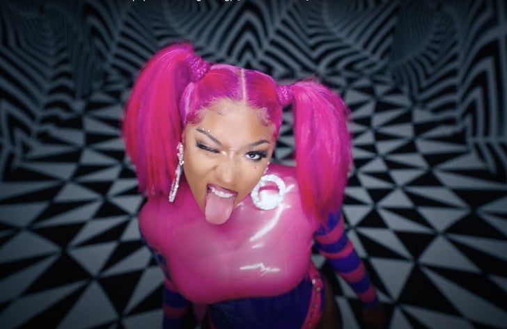 Hip Hop artist Megan Thee Stallion, captured in a playful moment, sticking her tongue out in a cheeky expression