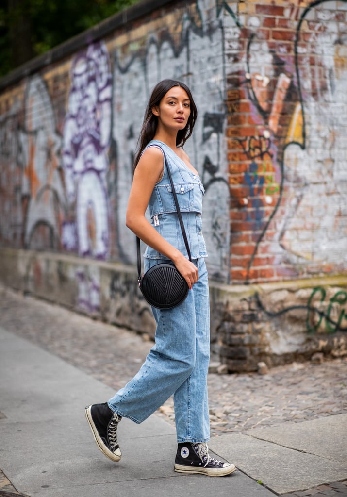 Laid-back, blazing days call for a denim tank, jeans, and Converse sneakers.