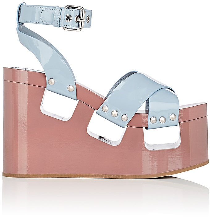 Slip into these chunky Miu Miu Patent Leather Platform-Wedge Sandals ($990).
