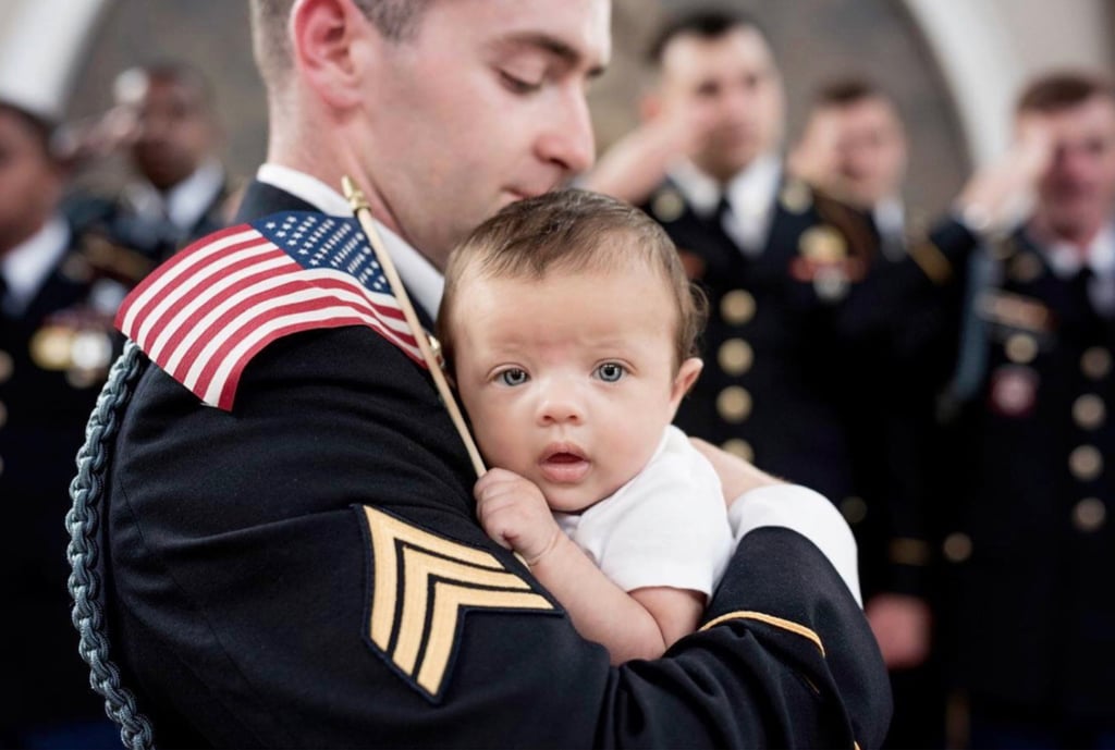 Daughter of Fallen Soldier Photographed With Army Members