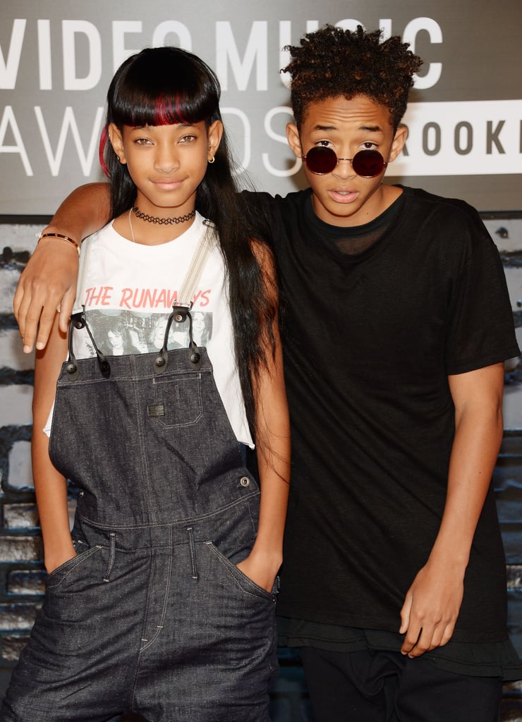 Accessorizing your bangs with hot-pink streaks (and a cool brother) is a plus in our book!
