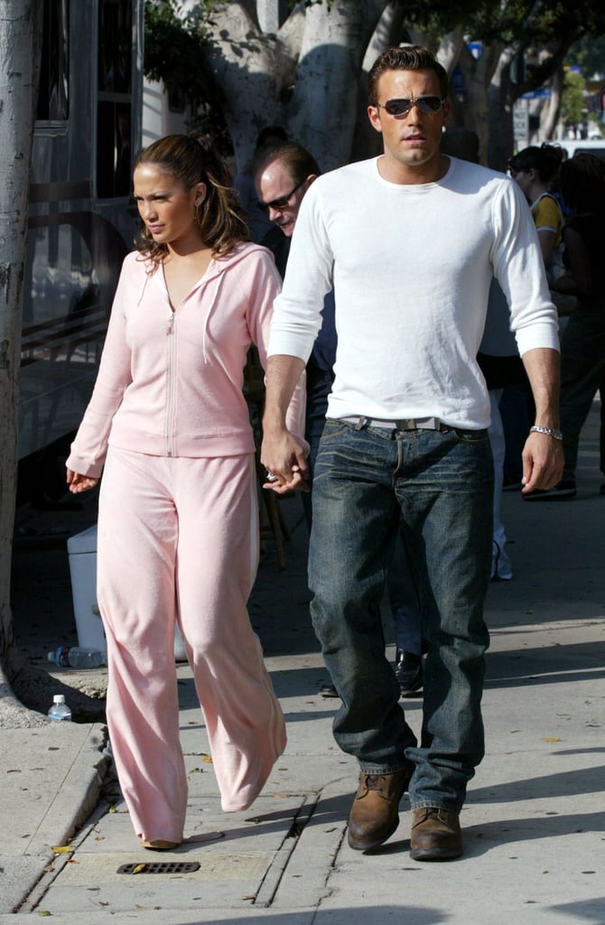 On a stroll in Beverly Hills in October 2002, the couple are an early aughts mood, from the baby pink velour tracksuit to the baggy jeans and shades.