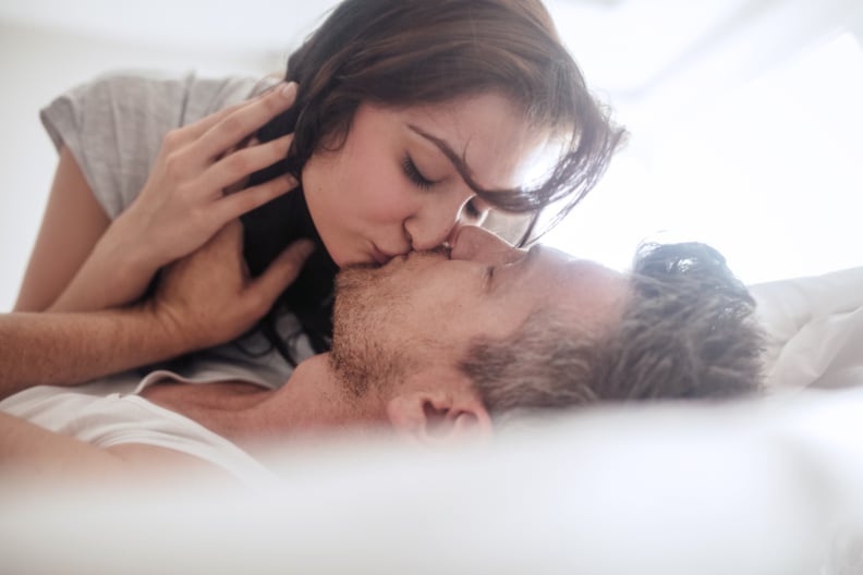 Man and Woman Kissing on Bed 