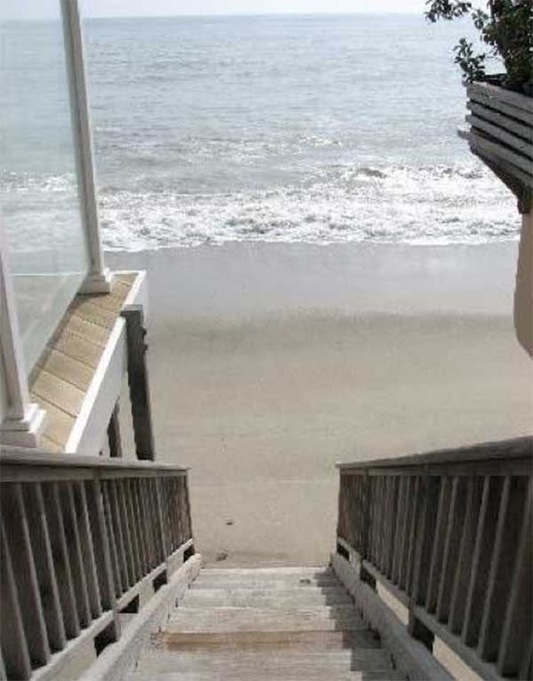 Talk about waterfront access! Stairs lead directly from the home's deck to the beach.
