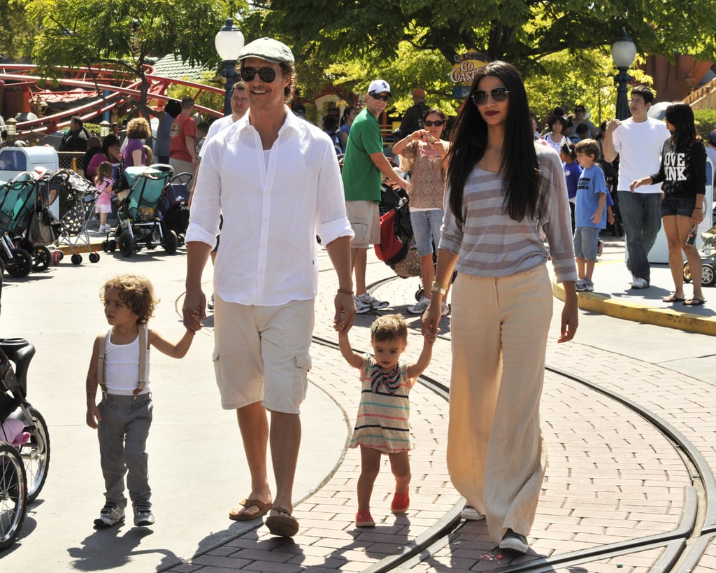 Matthew McConaughey and Camila Alves held hands with their kids, Levi and Vida, at Disneyland in June 2011.