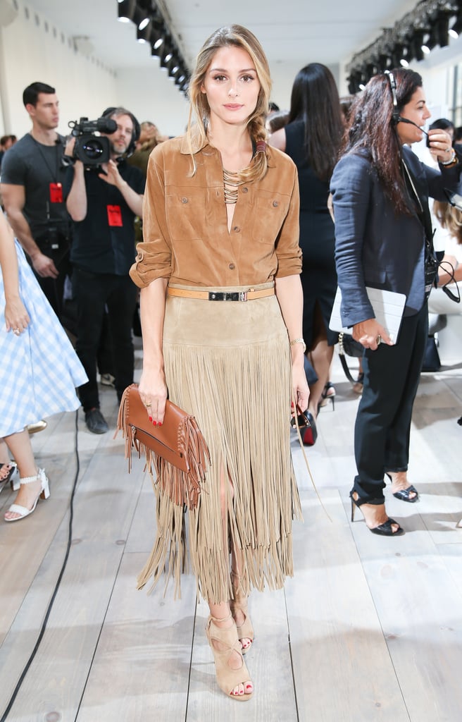 Never one to shy away from fringe, Olivia kept her color palette neutral but paired her textured bag with a suede two-tiered skirt.