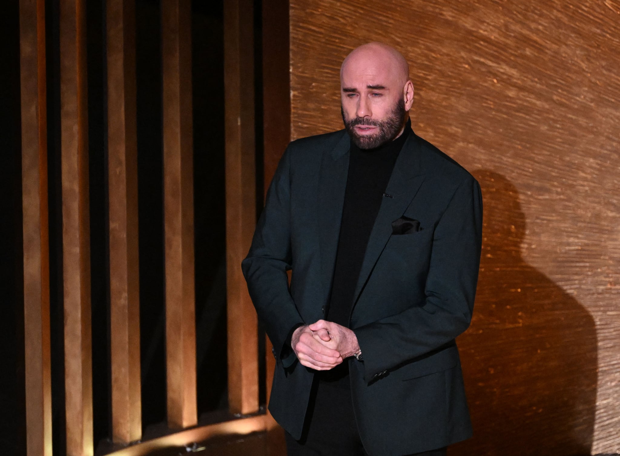 US actor John Travolta speaks onstage during the 95th Annual Academy Awards at the Dolby Theatre in Hollywood, California on March 12, 2023. (Photo by Patrick T. Fallon / AFP) (Photo by PATRICK T. FALLON/AFP via Getty Images)