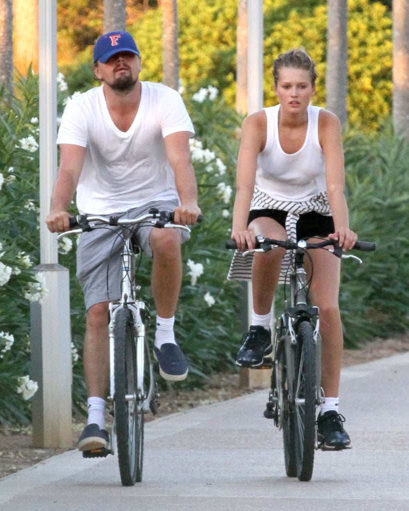 Leo rode a bike through Spain with his latest girlfriend, Toni Garnn, in August 2013.