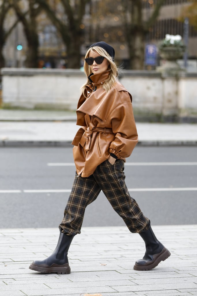 Tuck your plaid pants into a lug-sole boot and cinch your waist with a leather jacket.