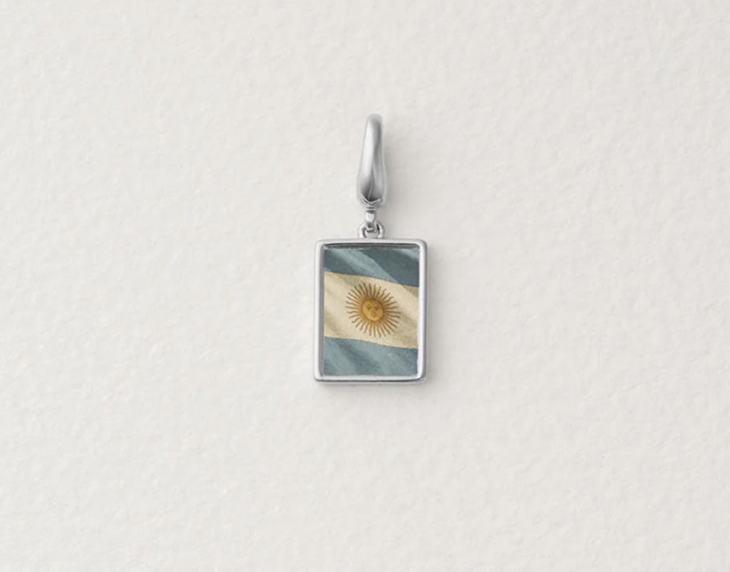 Raiz Wear Your Flag Charm ($65)
Jewelry is a fun and unexpected way to show your team pride, and Raiz makes it easy with their "Wear Your Flag" charms. Available in gold or silver, you can choose from a vast selection of teams including Argentina, South Africa, USA, and more. Wear this charm on the Raiz Olivia Paperclip Necklace ($70) or Raiz Olivia Paperclip Bracelet ($58) to complete the look.