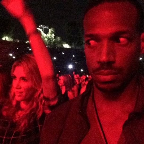 On Sunday, Marlon Wayans captioned this pictures: "Man I got the most UNRHYTHMIC WHITE WOMAN dancing next to me at the jay and bay concert . . . This b*tch dancing to AC/DC." The woman in question was Australian singer Delta Goodrem. 
Source: Instagram user marlonwayans