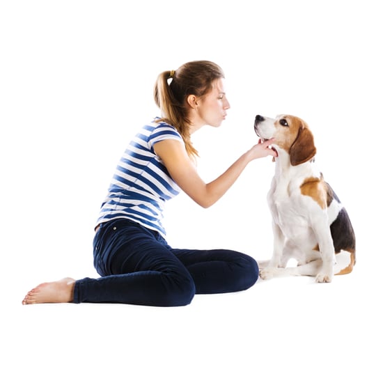 Woman Breastfeeds Puppy