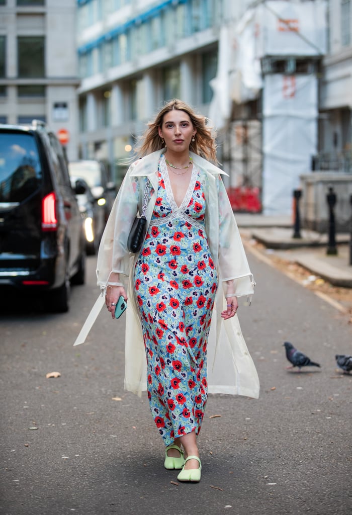 A sheer trench coat and minty-green flats add freshness to this floral midi dress.