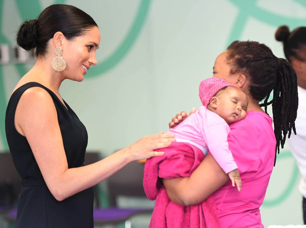 When She Softly Patted a Baby's Back Pictures of Meghan Markle With