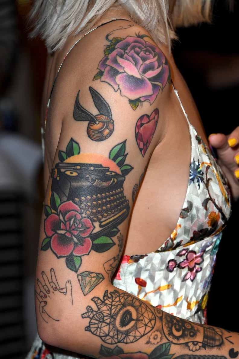Julia Michaels's Golden Snitch Arm Tattoo