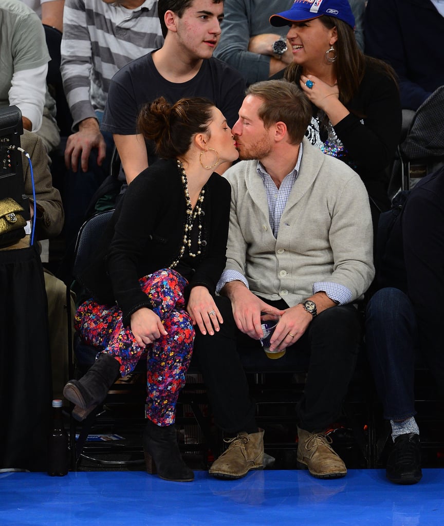 Drew Barrymore planted a kiss on her husband, Will Kopelman, as they sat courtside at a NY Knicks game in January.