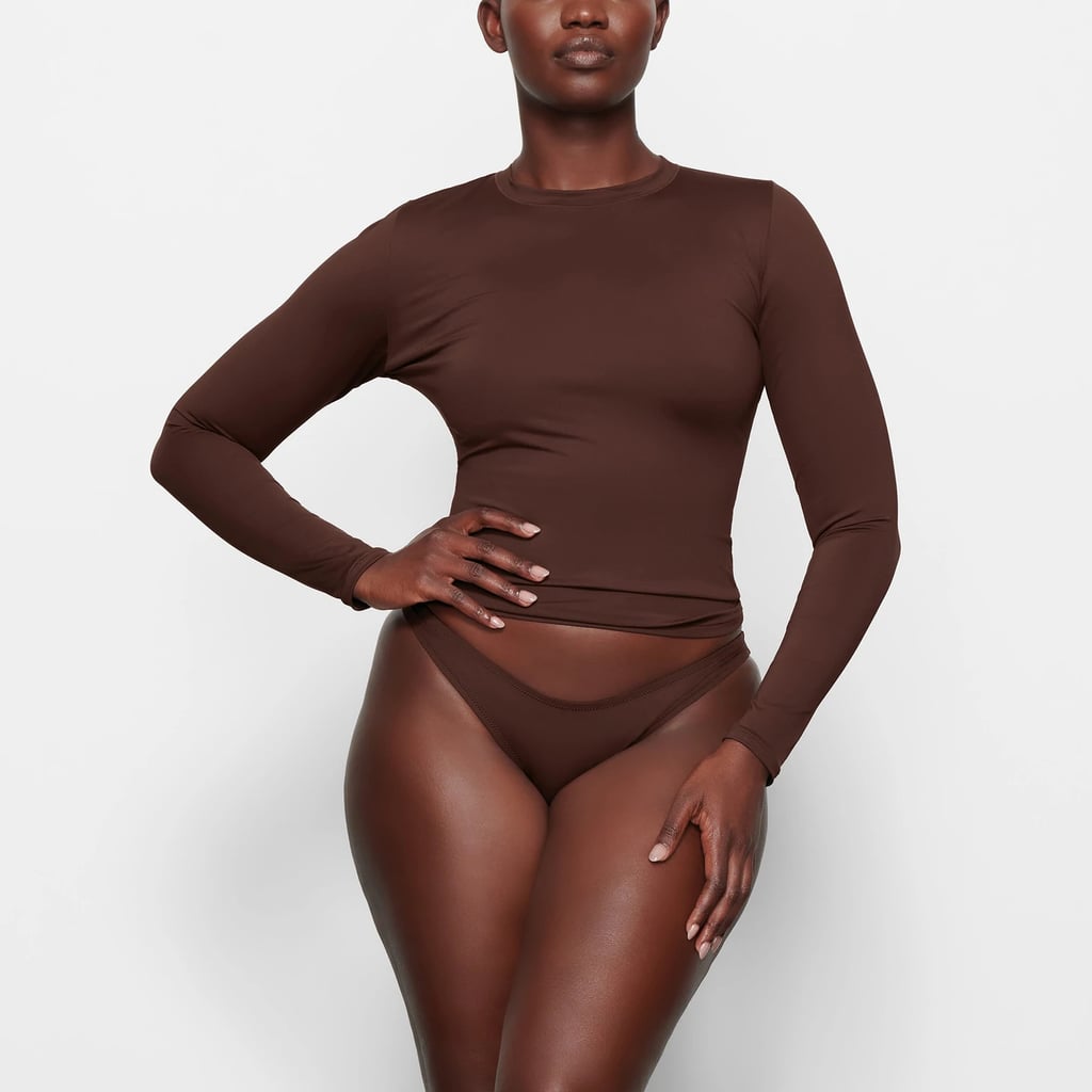 Skims Swim Long Sleeve Shirt + Cheeky Tanga Bottoms, Skims Launched a  Flattering Swimwear Line That's Already Selling Out