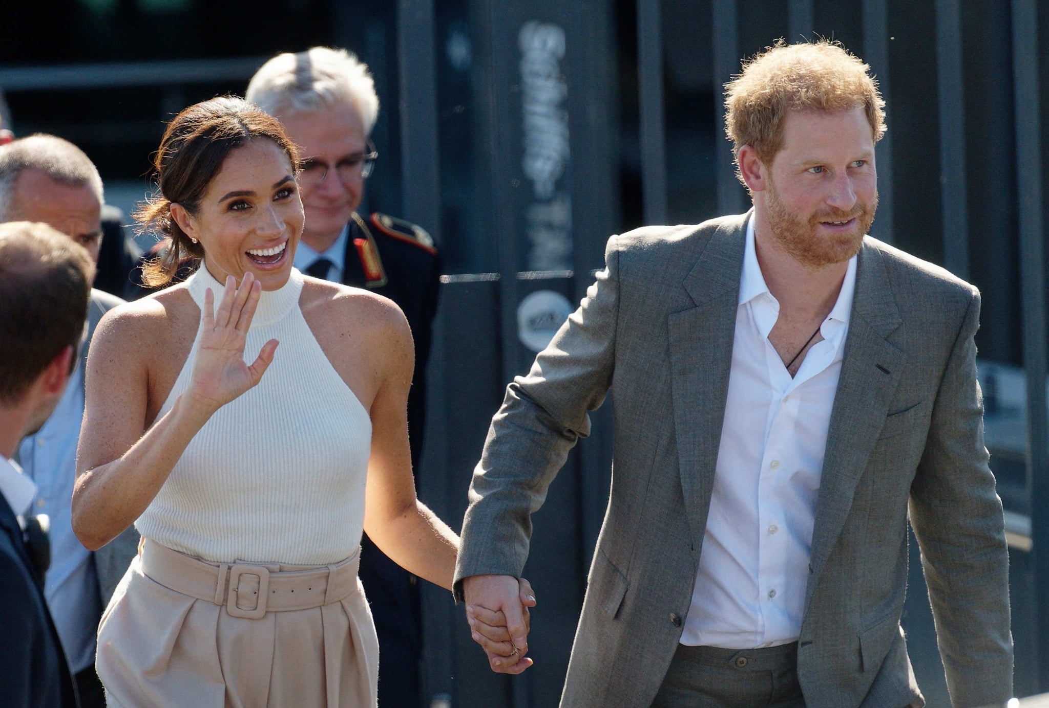 06 September 2022, North Rhine-Westphalia, Duesseldorf: Britain's Prince Harry (r), Duke of Sussex, and his wife Meghan, Duchess of Sussex, walk to a car after taking a boat trip on the Rhine. (recrop) The prince and his wife are coming to Düsseldorf to promote the 2023 