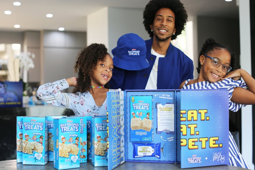 Ludacris and his daughters pose with his new Rice Krispies Treats "Treat. Eat. Compete." game set.