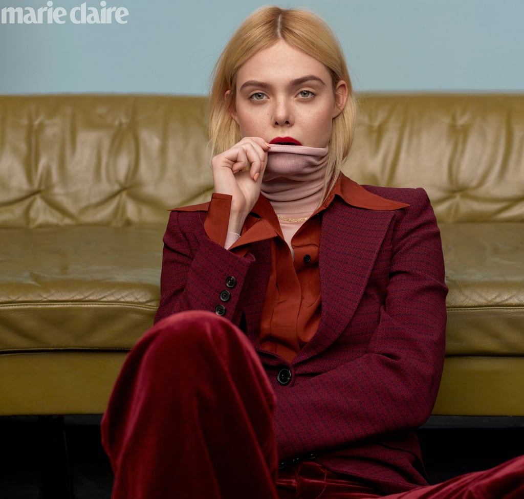 Elle Fanning wearing a Victoria Beckham jacket, top, and turtleneck, Marc Jacobs pants, and a Zales necklace.