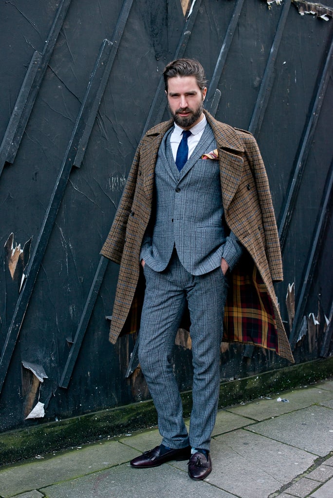 This kind of dapper suit and nonchalantly layered overcoat wouldn't just be a great look for your guy — take notes and steal the look for yourself.