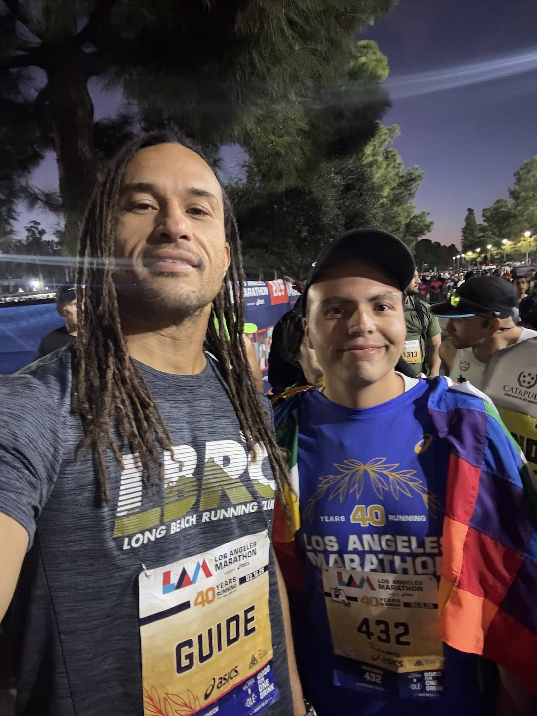Victor Camara a marathon guide with his runner Romario.