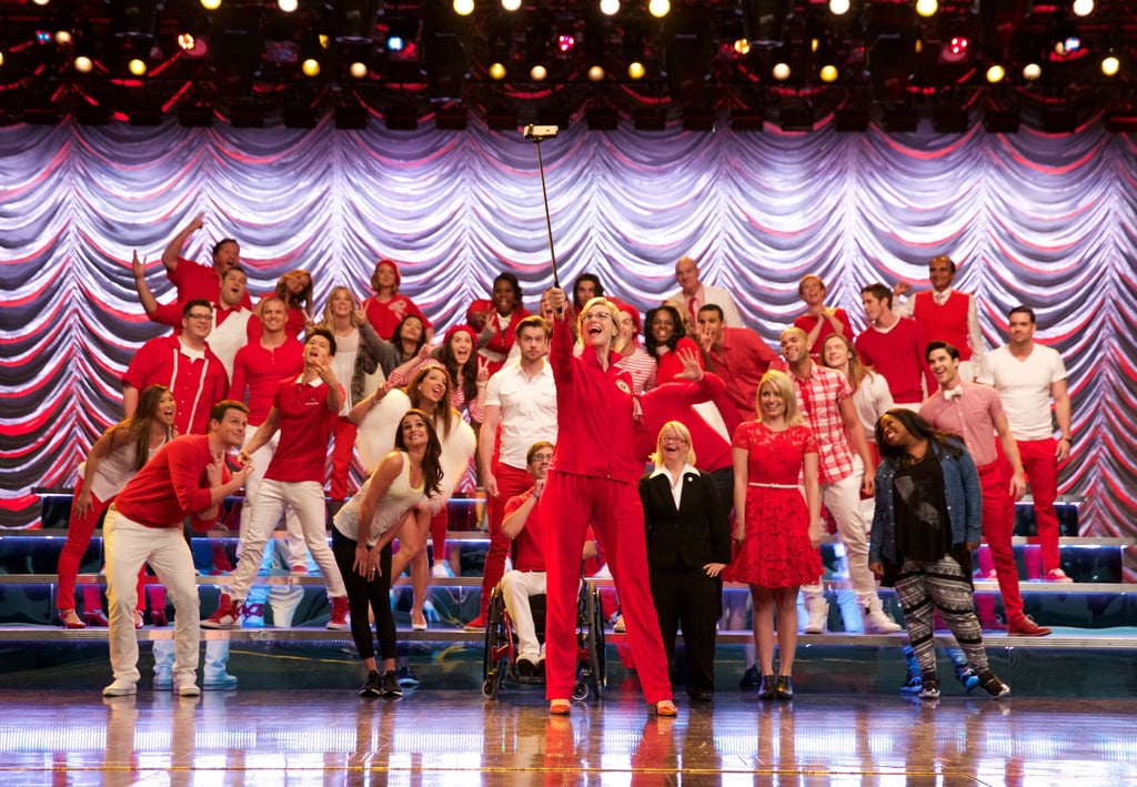 Sue snags a selfie stick to take a picture of the whole, epic cast.