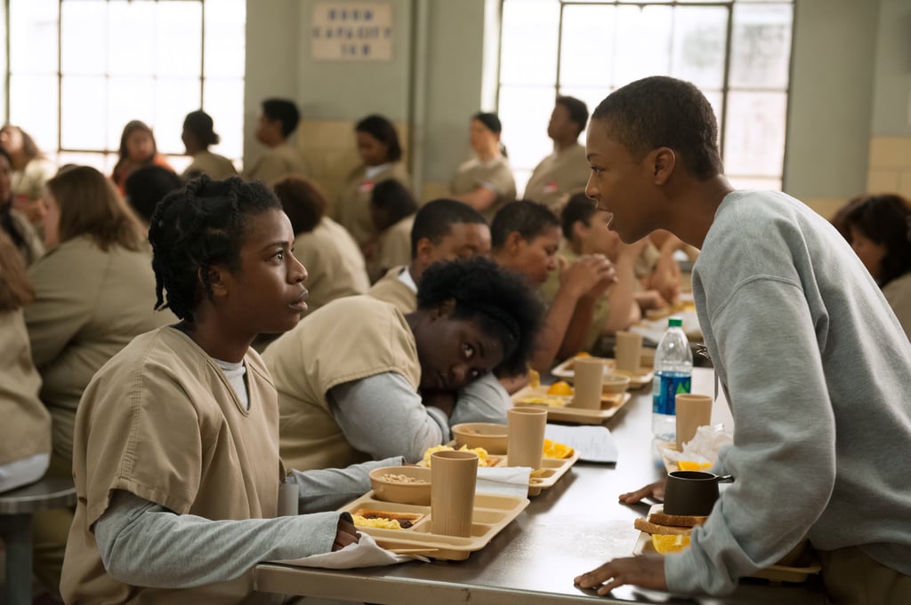 Crazy Eyes (Uzo Aduba) and Poussey (Samira Wiley) get into it in the cafeteria.