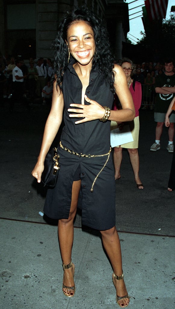 At the premiere of The Others in 2001 wearing a black dress and gold chain-link belt.