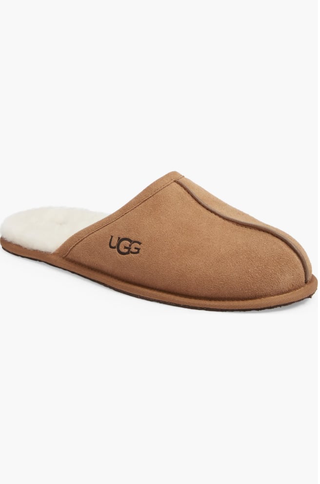 UGG Scuff Slippers ($100)
Dads deserve to be cozy, too! Get him something that exudes comfy vibes with a luxurious flair, like these UGG Scuff Slippers. Available in seven neutral and grounding colors, these will be his new favorite house slippers. The suede slipper is lined with shearling and wool for an ultra-soft feel. Trust us, this present will be something he actually uses all the time.