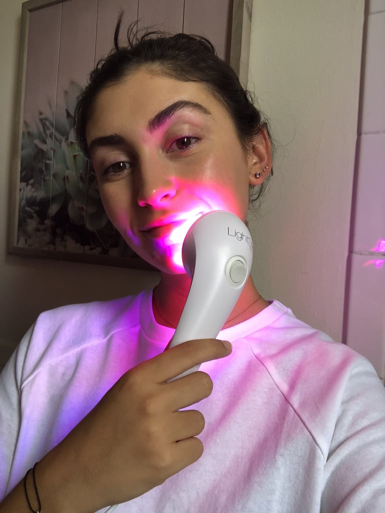 I started using the Lightstim wand every day in my nighttime skin-care routine, after double cleansing. It's super easy to use — there's only one button on the handle that switches the device on and off and the LED light works in three-minute increments. You hold the wand gently to your face and after the three-minute timer beeps, you move it to another area or switch it off. What I love about the wand as opposed to a full-face mask is the ability to target the LED light to the lower half of my face. The device gets warm to the touch but not hot, and is completely painless. When you're watching Netflix or scrolling Instagram, three minutes goes by fast.