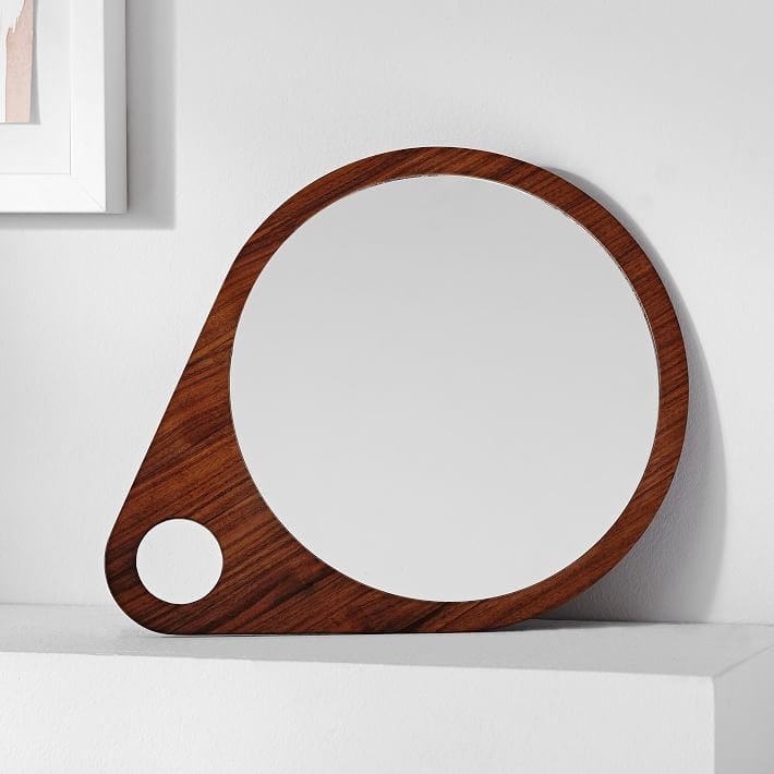 We're loving the clean lines on this contemporary interpretation of an antique vanity mirror ($60). Handcrafted and carved from walnut, it's sized just right to sit pretty on a bedroom dresser or atop the mantel. 
— MW
