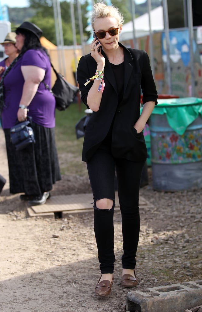 Carey Mulligan sported ripped jeans with brown loafers while navigating the Glastonbury grounds.
Carey Mulligan sported ripped jeans with brown loafers while navigating the Glastonbury grounds.